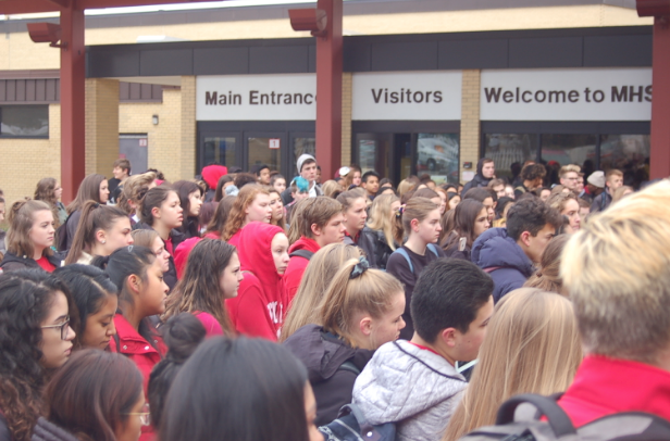 A crowd that grew to over 180 students gathers in front of the school’s main entrance on November 19 to listen to their peers speak out against sexual harassment and assault at MHS. 