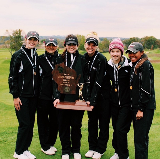 The Middleton Girls Golf team celebrates their State Championship victory at University Ridge Golf course October 14 and 15. The team shot a combined 651 over two days.