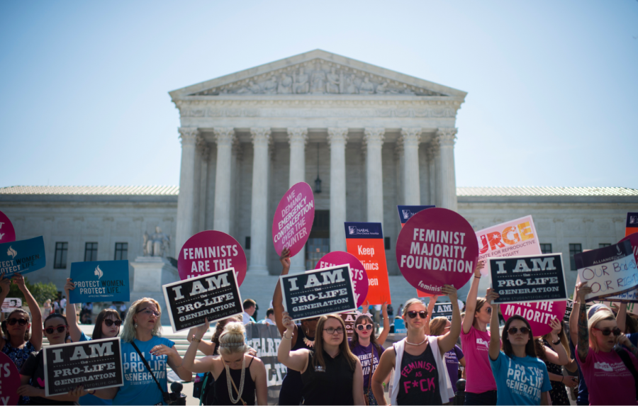 On June 20, 2016, a group of Catholics were standing outside of the Supreme Court Building, praying that the Supreme Court would overturn Roe vs Wade. Pro-choice supporters also came out to stand with the courts to keep abortion legal.