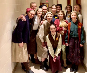 Cast members from MHS theatre’s production of “I Never Saw Another Butterfly” gather after a February 2019 performance. Cast gatherings look different this year under COVID-19 restrictions. From left to right: Nick Tormey, Elora Doxtater, Nellie Gestring, Cate Ohly, Zoe Howard, Tanner Choate, Rhiannon Teschner, Vivian Szot, Ceia Kasper, Evelyn Williams, Johanna Bieske, Cheyenne Halverson. 