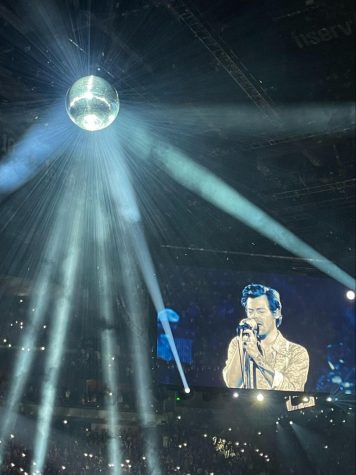 Harry Styles performs “Lights Up” and spins disco balls during his concert in Milwaukee. 