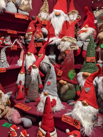 Adorable gnome dolls epitomize the holiday spirit with their green and red clothes, snow-white beards, and button noses. Their tall hats are decorated with embroidered patterns, felt hearts, stripes, and feathers. 

