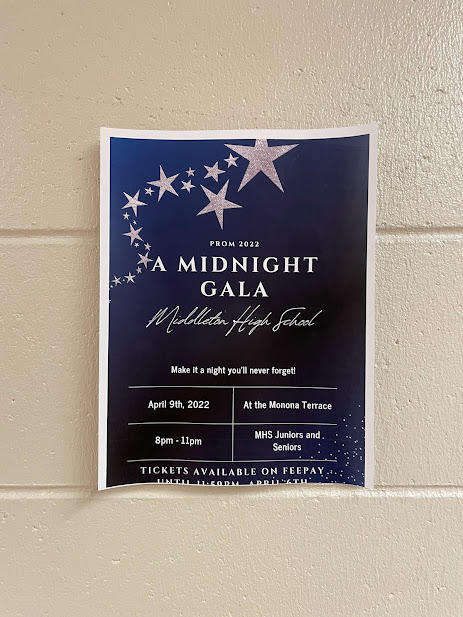 The poster for A Midnight Gala was designed by a student on the prom committee. It features the blues and silvers that will be present in the proms decorations.