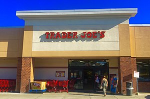 A Trader Joe’s store front.  You can find Trader Joe’s in Madison on Monroe Street with their famous red font.