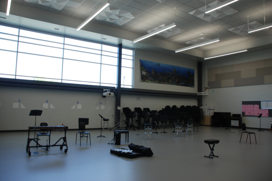 The orchestra room has softer floors — good for wooden instruments — and a humidity-controlled cello and bass storage room to keep instruments in good shape. The mural on the back wall was transferred from the original orchestra room over the summer. 