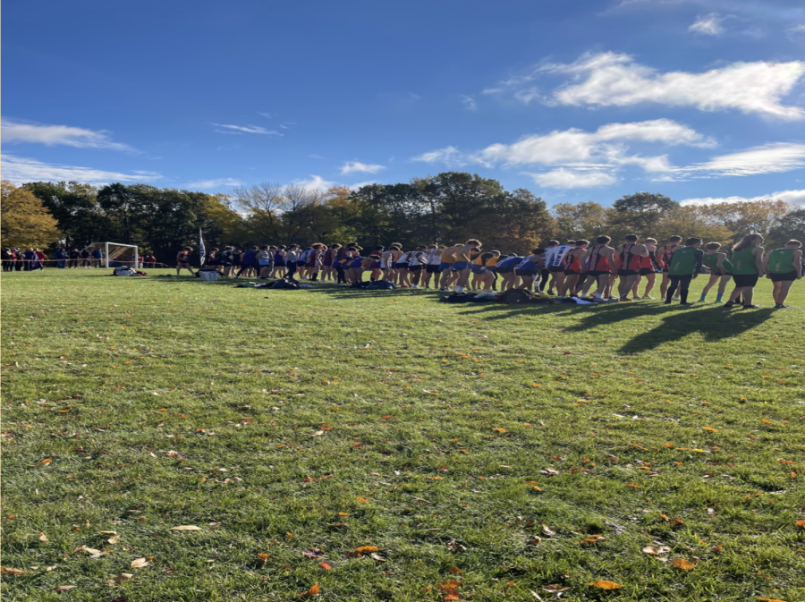 The Middleton High School varsity boys cross country team lines up to compete in the 2022 Big 8 Cross Country Conference.