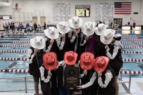 The 2022 State team poses at Sectionals the week prior with their celebratory cowboy hats and first-place trophy! (From L-R) Audrey Alexander (10), Sophie Benson (12), Natalie Charles (12), Abby Ensenberger (12), Isabell Frommelt (10), Piper Garcia-Hall (11), Tait Haag (11), Hannah Machleidt (10), Lily Mair (11) and Sulia Miller (9) Emma Kleine (12)