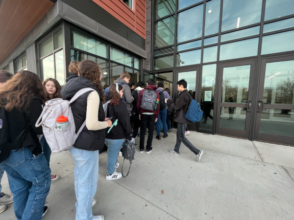 Students at Middleton High School line up at the north entrance, a crowd caused by the new student ID policy.