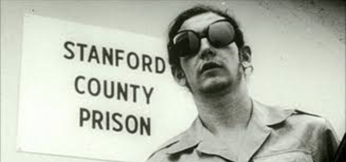 A guard, featuring the typical mirrored sunglasses of the experiment, was photographed next to the experimental prisons entrance.