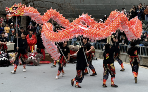 Dragon dancers celebrating Lunar New Year in Oklahoma City, OK. The red color of the dragon symbolizes luck.